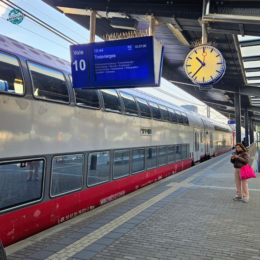 Station platform with departure screen and clock
